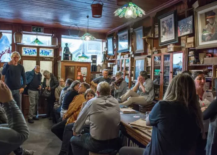 A lively pub scene with patrons enjoying live music.