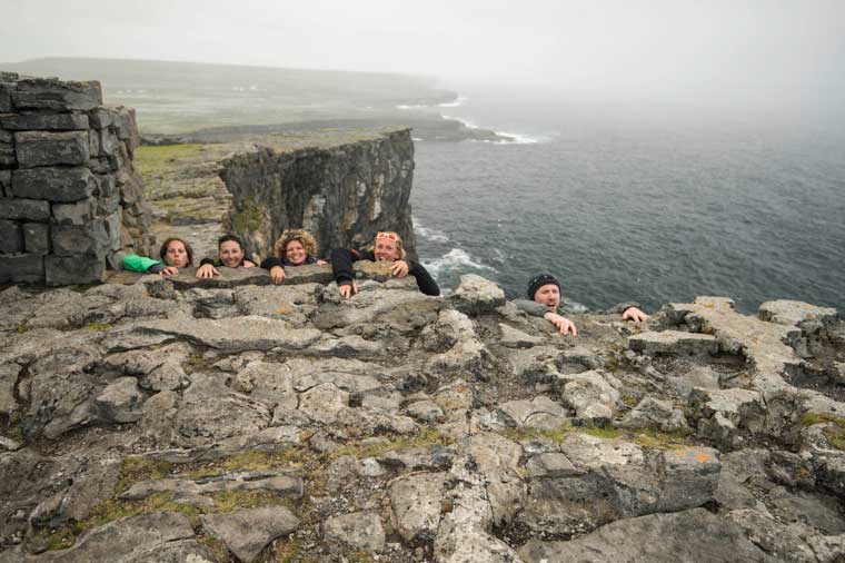 Hanging on for dear life on the cliffs of Dún Aenghus, Inis Mór - one of the Aran Islands