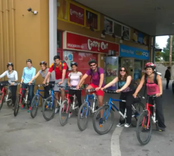 Group of cyclists ready for a ride on an urban street.