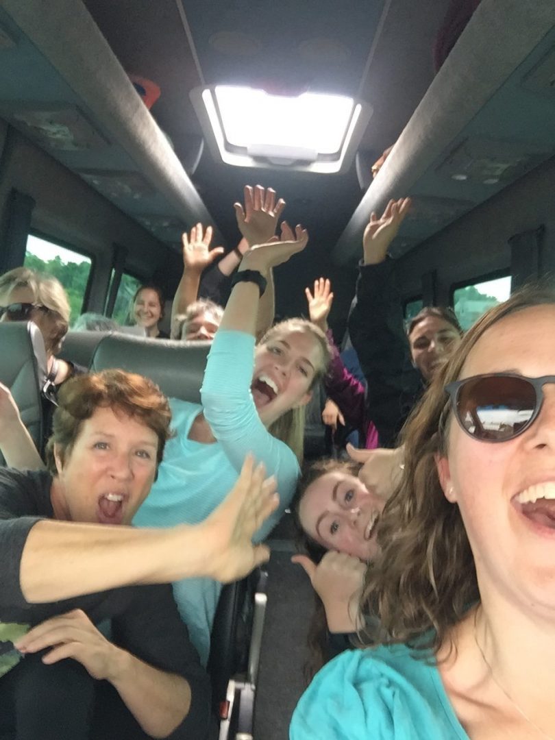 A group of people having a good time on an Overland Ireland bus trip