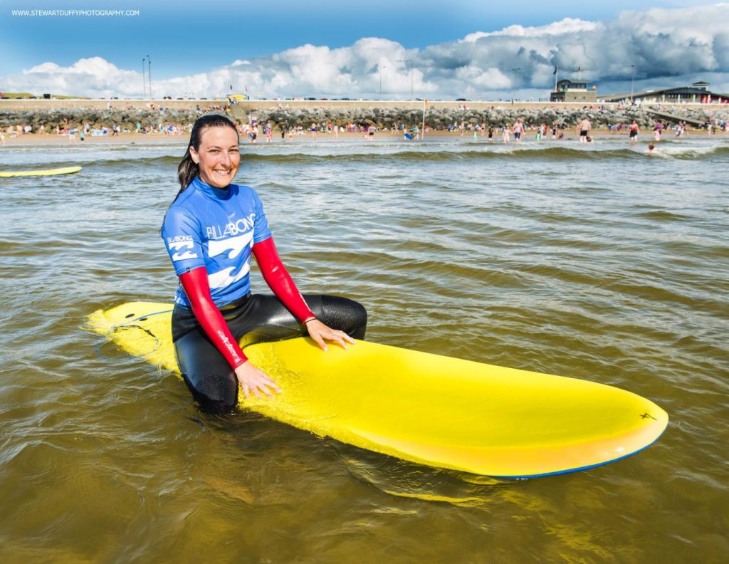 Woman on surf board in Ireland