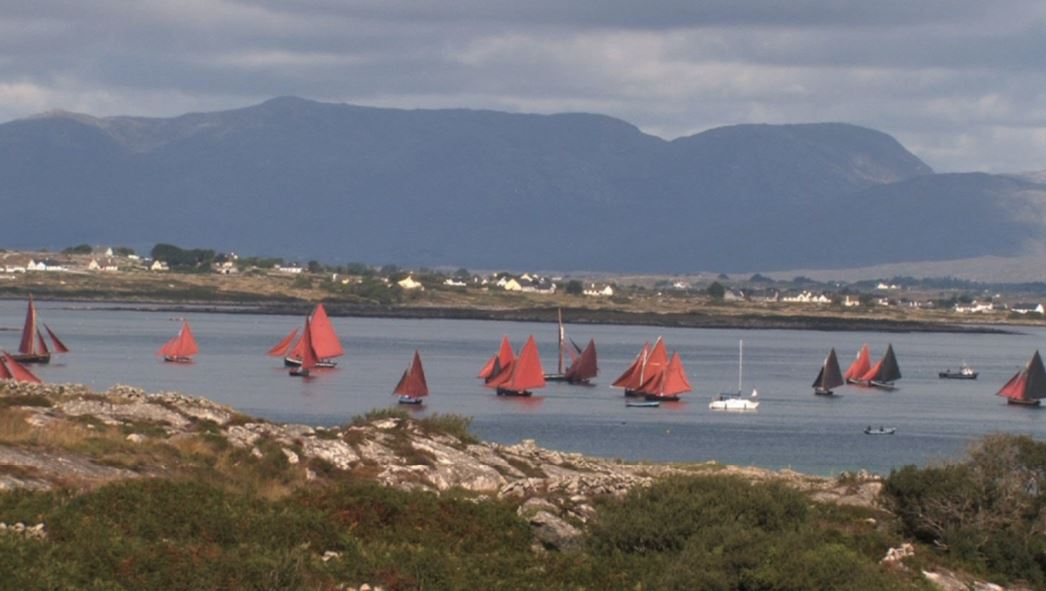 A collection of Galway Hookers - small boats with red triangular sails