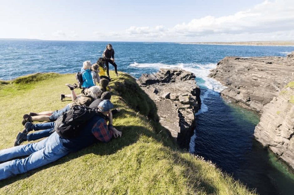 A group of travellers at an Irish cliff