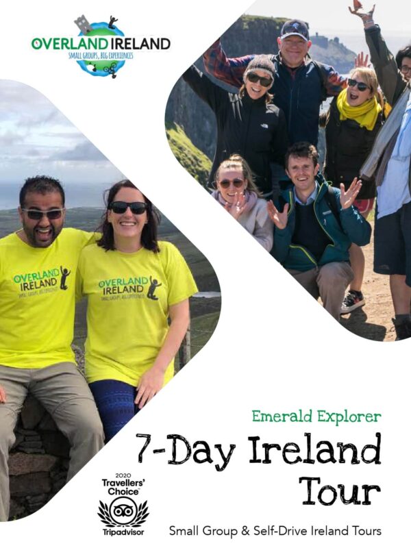 Small group of smiling tourists with a tour guide promoting Overland Ireland's 7-day private Ireland tour.