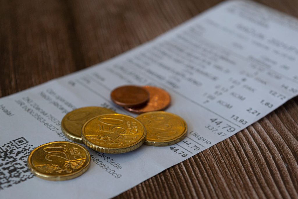 Coin tips in euros on receipt 