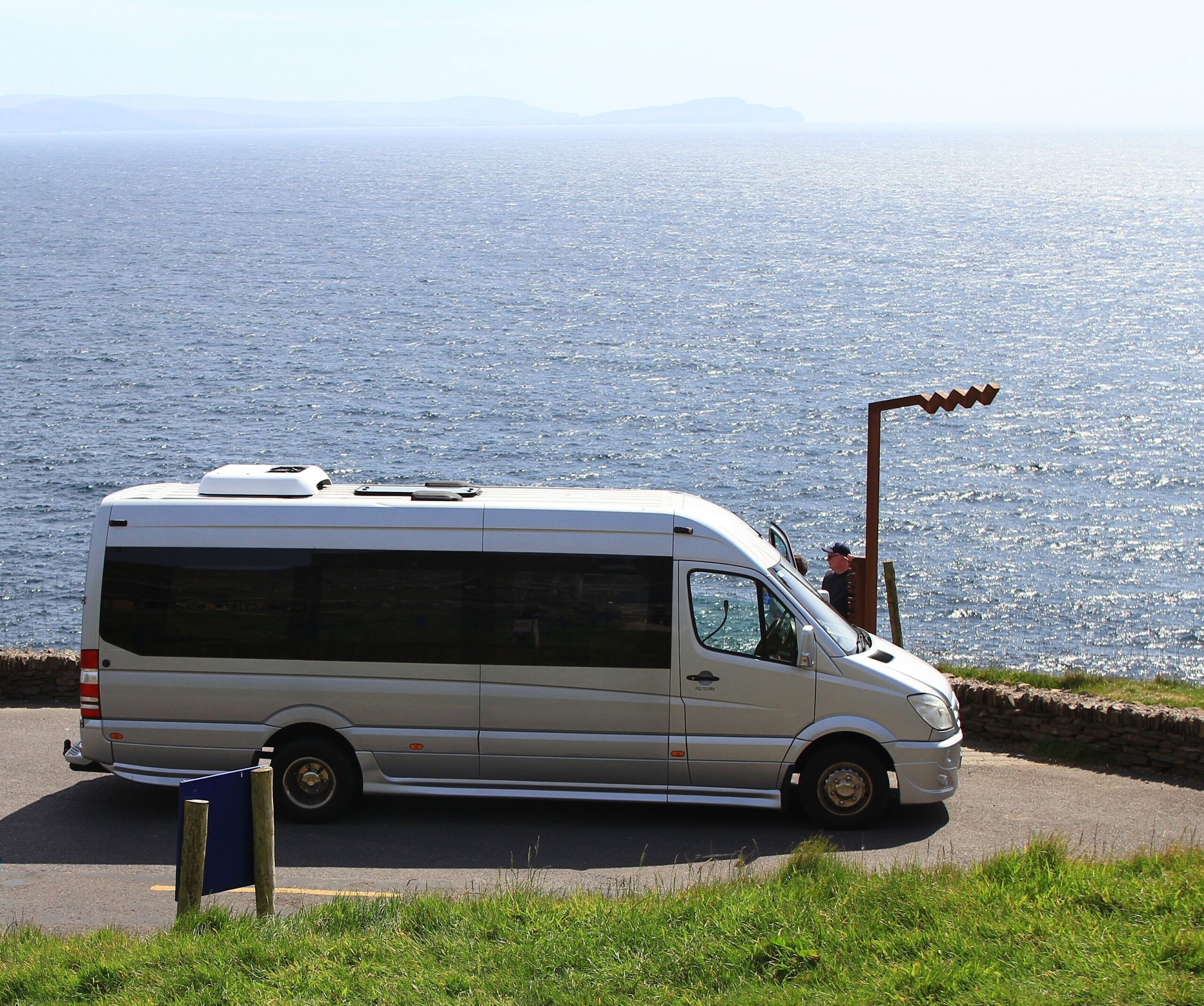 One of Overland Ireland's mini-coaches on a beautiful sunny Irish day