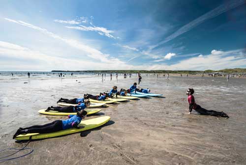 Surfing lessons on a beach in Ireland