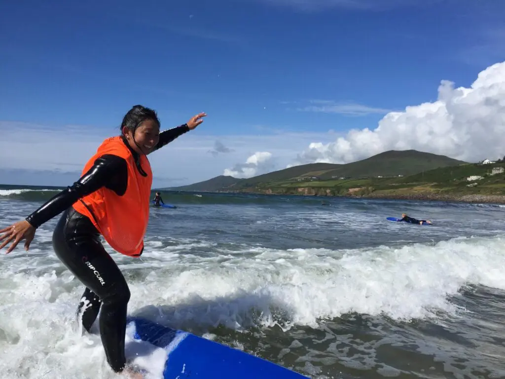 woman surfing in Ireland